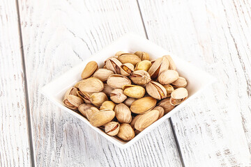 Salted tasty pistachio nuts heap