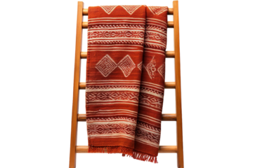A Vibrant Woven Throw Draped on a Wooden Ladder, Ready to Embrace Warmth and Comfort on a Clear PNG or White Background.