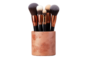 A Collection of Makeup Brushes Standing in a Copper-Colored Holder on a Clear PNG or White Background.