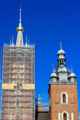 Towers of St. Mary's Basilica at the Main Market Square in the Old Town of Krakow, Poland. Bazylika...