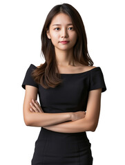 Fototapeta premium A poised young woman with a composed expression, dressed in an elegant off-the-shoulder black dress. Her confident stance and stylish attire highlight her sophistication and grace