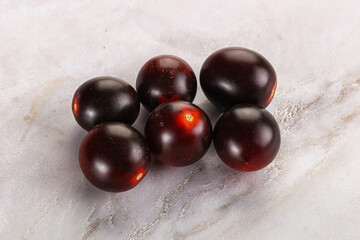 Raw ripe black kumato tomato