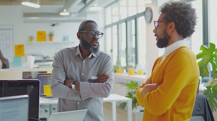 Detailed shot of a mentor giving guidance to a startup owner in a bright workspace
