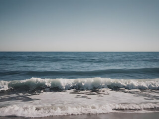 Fototapeta premium Calm ocean waves with a blue sky background