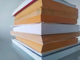 close up view of a stack of books on a table