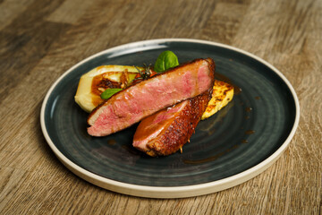 Grilled duck breast filet with cabbage and tomato