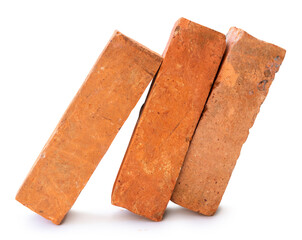 Side view of old orange or red bricks in stack isolated on white background with clipping path