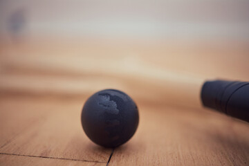 Closeup, rubber and racket with ball for squash, competition and match for professional athletics....
