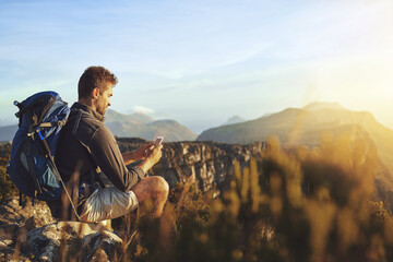 Travel, hiking and man on mountain with phone for geology career with digital nomad for adventure....