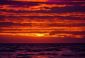 Obraz premium vibrant sunset casting golden glow over calm ocean horizon silhouetted dramatic sky, waters, colorful, serene, dusk, peaceful, seascape, twilight, tranquil