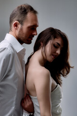 Man and woman are standing close to each other