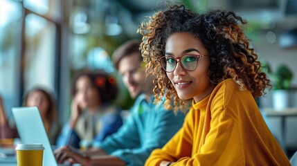 A diverse group of colleagues working together in a bright and modern office. The innovative workspace showcases collaboration and productivity.