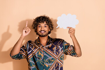 Photo portrait of handsome young male hold look paper cloud eureka dressed stylish print garment...