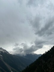 time lapse of clouds over mountains