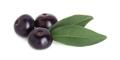 Fresh ripe acai berries and green leaves isolated on white