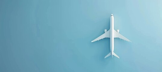 White Airplane Toy Model on a Pastel Blue Background, Minimalist Travel Design with Copy Space.