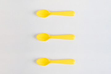 Yellow spoon isolated on white background.