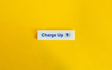 Charge Up Verb and Charging Battery Icon. Energize, Excite, Stimulate, Revitalize, Invigorate, Boost, Rejuvenate, Motivate