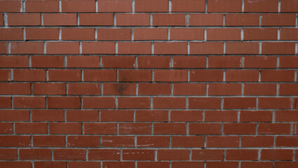 the texture of a dark red brick wall