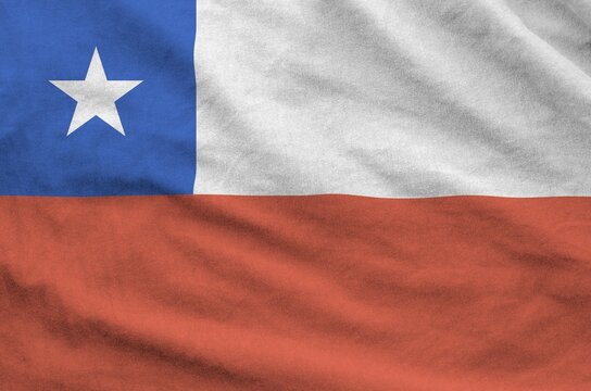 Chile flag depicted on folded wavy fabric of old cloth close up - Powered by Adobe