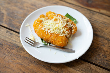 Crispy fried bananas topped with cheese, highlighting a delicious and indulgent treat, perfect for food, dessert, and culinary