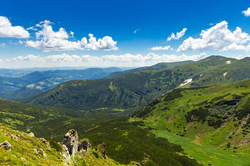 A beautiful landscape in the mountains, the sky with clouds on a summer day.
