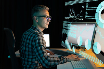 Man Working With Modern Computer Interfaces Analyzing Data And Creating Reports