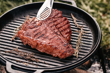 fresh beef meat prepared on a grill. porterhouse steak or T Bone Steak