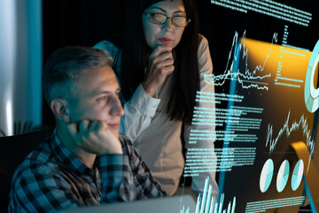 Business Team Analyzing Data On Transparent Screen. Collaborative Work, Data Analysis, Technology Insight, Digital Transformation, Innovation. Engaged Professionals, Modern Office Environment.