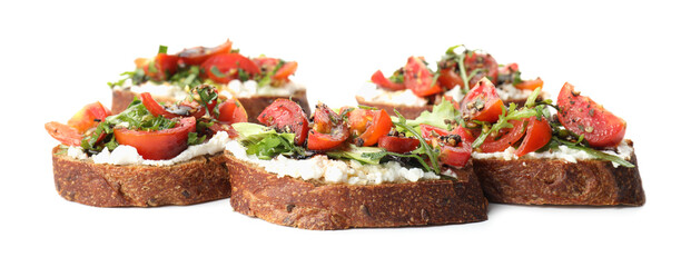Delicious bruschettas with ricotta cheese, tomatoes and arugula isolated on white