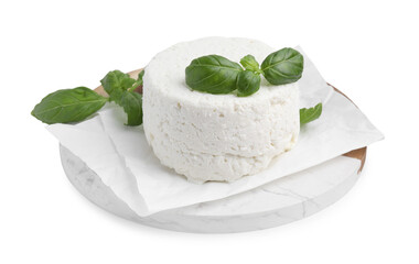 Fresh ricotta (cream cheese) and basil isolated on white