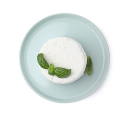 Fresh ricotta (cream cheese) and basil isolated on white, top view