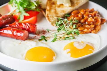 delicious traditional english breakfast on a white plate
