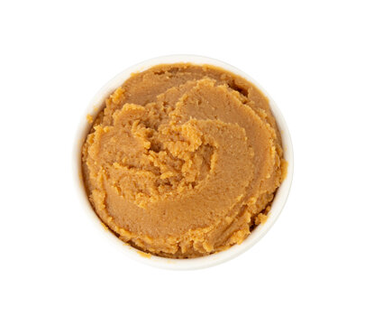 Miso paste isolated. Japanese shiro miso seasoning sauce, fermented soybean spread, brown soy cream