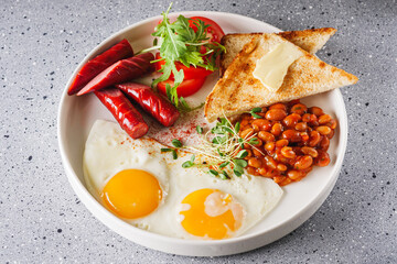 delicious traditional english breakfast on a white plate