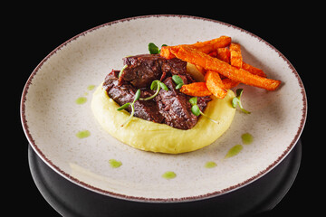 delicious stewed beef cheeks on mashed potatoes