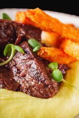 delicious stewed beef cheeks on mashed potatoes