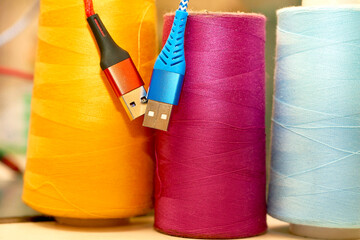 Tailoring supplies, spools of thread.Two usb cables for connection