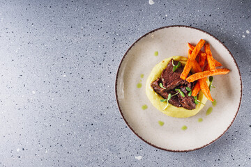 delicious stewed beef cheeks on mashed potatoes