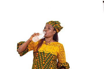 portrait of a mature beautiful woman drinking water from a plastic bottle.