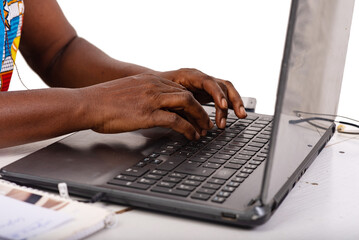 close up of female hands typing keyboard on laptop.