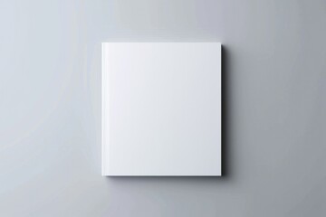 Naklejka premium Square Brochure Cover. Photorealistic Mockup of Blank Square Brochure on Light Grey Background