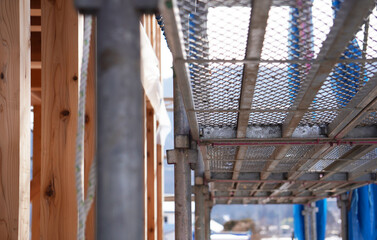 New House Construction Site with Scaffolding（足場を組んだ新築住宅の建築現場）
