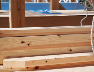Lumber Stacked at New House Construction Site（木材がたくさん積まれた新築住宅の建築現場 ）