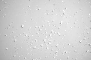 Water drops on white wall background texture