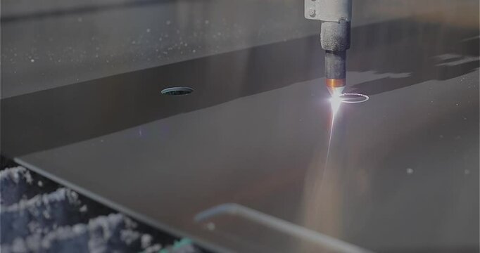 The process of cutting a metal part with a plasma cutter. Plasma cutting. Plasma cutter work at the factory. The plasma cutter will cut the part.