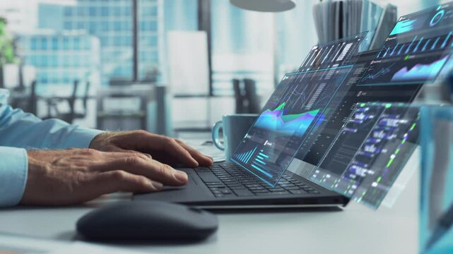 Close Up on Person's Hands Using a Laptop Computer with Analytical Data Presented in Futuristic Holographic Visualization with Graphs and Charts. Anonymous Man Working on Reports in a Modern Office