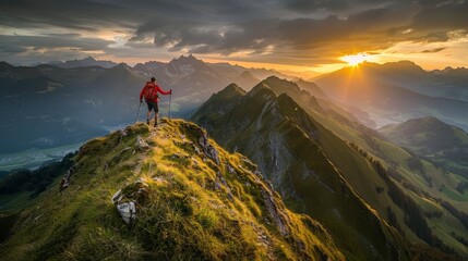A lone hiker stands on a mountain peak, gazing at a breathtaking sunset over a valley.