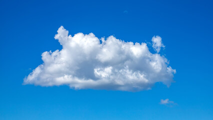 Beautiful cloudscape of nature single white cloud on blue sky background in daytime