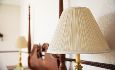 Close up photo of old fashioned retro luxury bedside lamps in bedroom